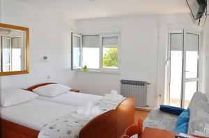 Posteľ alebo postele v izbe v ubytovaní Sunrise Apartments and Studio Apartments
