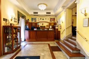a room with a staircase and a bar at Hotel Stromboli in Rome