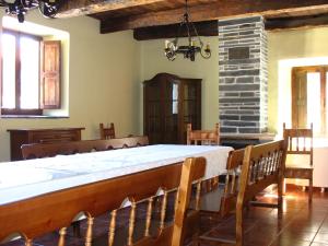 a large room with a large table and chairs at Brañuelas, Estacion 1 in Brañuelas
