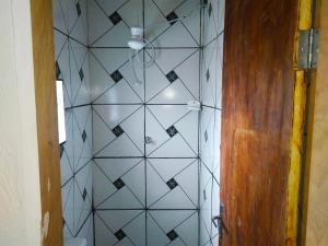 a tile wall in a hallway with a ceiling at Atlantic Hotel - Campo Grande in Campo Grande