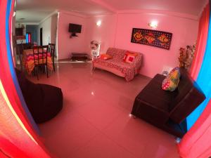 an overhead view of a living room with pink walls at Apartamentos Ksan in San Andrés