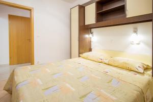 Postel nebo postele na pokoji v ubytování Apartment Dani
