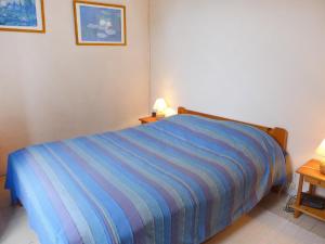 Ένα ή περισσότερα κρεβάτια σε δωμάτιο στο Holiday Home Le chant des milans by Interhome