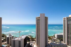 a view of a city with the ocean and buildings at Ocean View Studio, Near Waikiki Beach in Honolulu