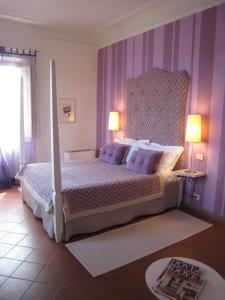 Postel nebo postele na pokoji v ubytování Fontelunga Hotel & Villas