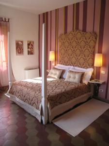 Postel nebo postele na pokoji v ubytování Fontelunga Hotel & Villas