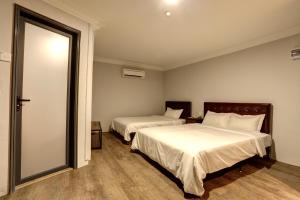 Postel nebo postele na pokoji v ubytování Hotel Kristal
