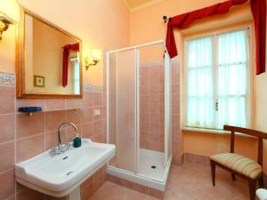 a bathroom with a sink and a shower at Villa Paolotti by Interhome in Bettona