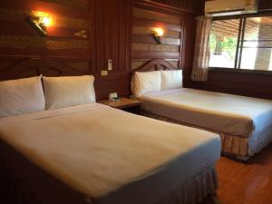 Ein Bett oder Betten in einem Zimmer der Unterkunft Railay Viewpoint Resort