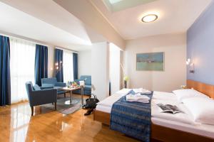 Ένα ή περισσότερα κρεβάτια σε δωμάτιο στο Hotel Amaris