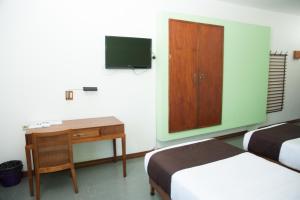 TV a/nebo společenská místnost v ubytování Motel d'Antananarivo