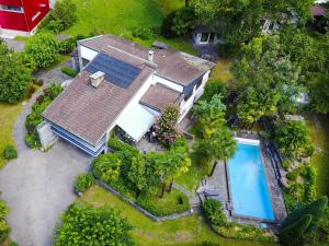 an overhead view of a house with a swimming pool at Villa delle Palme in Coglio