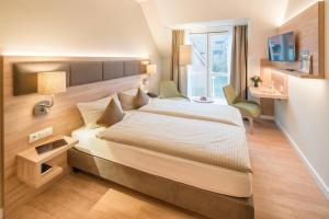 Ein Bett oder Betten in einem Zimmer der Unterkunft Hotel Altes Zollhaus