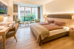 Ein Bett oder Betten in einem Zimmer der Unterkunft Hotel Altes Zollhaus