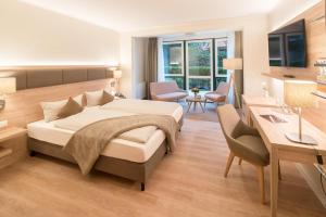 Ein Bett oder Betten in einem Zimmer der Unterkunft Hotel Altes Zollhaus