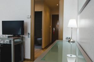 TV a/nebo společenská místnost v ubytování Hotel Mas Camarena