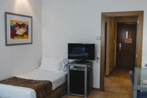 TV a/nebo společenská místnost v ubytování Hotel Mas Camarena