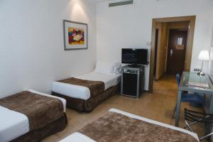 Postel nebo postele na pokoji v ubytování Hotel Mas Camarena