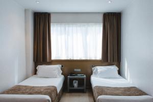 Postel nebo postele na pokoji v ubytování Hotel Mas Camarena
