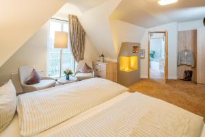 Ein Bett oder Betten in einem Zimmer der Unterkunft Hotel Altes Zollhaus