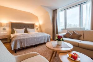 Ein Bett oder Betten in einem Zimmer der Unterkunft Hotel Altes Zollhaus