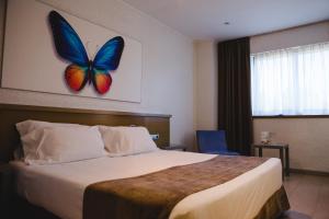 Postel nebo postele na pokoji v ubytování Hotel Mas Camarena