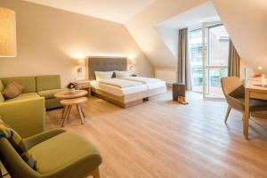 Ein Bett oder Betten in einem Zimmer der Unterkunft Hotel Altes Zollhaus