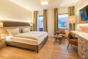 Ein Bett oder Betten in einem Zimmer der Unterkunft Hotel Altes Zollhaus