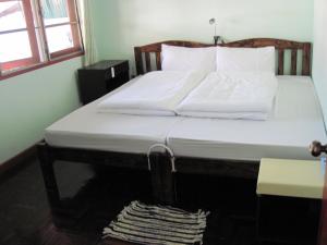 Postel nebo postele na pokoji v ubytování Sakura House