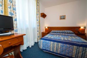 Postel nebo postele na pokoji v ubytování Hotel Beau Site