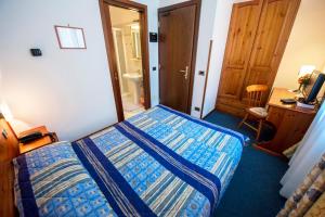 Postel nebo postele na pokoji v ubytování Hotel Beau Site