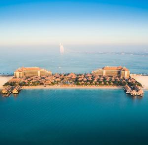 a large body of water with a lighthouse at Anantara The Palm Dubai Resort in Dubai