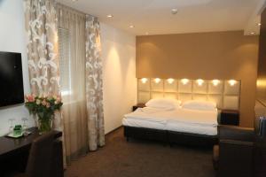 Säng eller sängar i ett rum på Prielmayerhof HOTEL