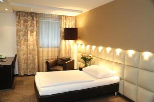 Łóżko lub łóżka w pokoju w obiekcie Prielmayerhof HOTEL
