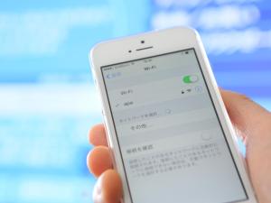 a person holding a cell phone in their hand at APA Hotel Shimbashi Onarimon in Tokyo