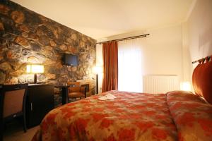 Postelja oz. postelje v sobi nastanitve Domotel Neve Mountain Resort