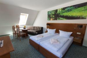 Ένα ή περισσότερα κρεβάτια σε δωμάτιο στο Gasthof zum Slawen