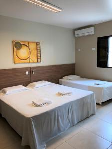 Postel nebo postele na pokoji v ubytování Hotel 2 Gauchos