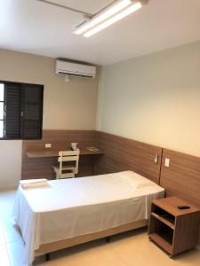 Postel nebo postele na pokoji v ubytování Hotel 2 Gauchos