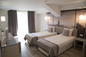 Postel nebo postele na pokoji v ubytování Tsarsko Selo Spa Hotel + 54 fotografií