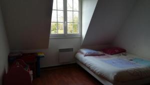 En eller flere senge i et værelse på Entre mer montagne Béarn et Pays Basque