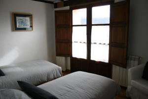 Postel nebo postele na pokoji v ubytování Casa Guareña