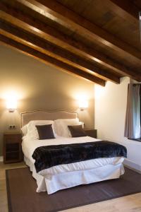 Cama o camas de una habitación en Osabarena Hotela