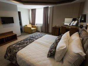 Ένα ή περισσότερα κρεβάτια σε δωμάτιο στο Hotel Ideo Lux