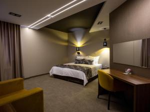 Ένα ή περισσότερα κρεβάτια σε δωμάτιο στο Hotel Ideo Lux