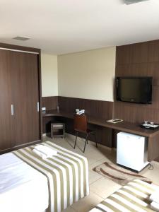 Postel nebo postele na pokoji v ubytování Hotel 2 Gauchos