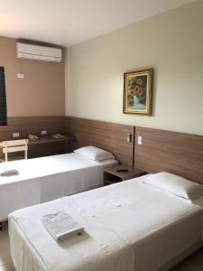 Postel nebo postele na pokoji v ubytování Hotel 2 Gauchos