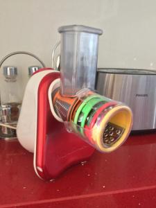 a blender sitting on top of a red counter at Amphora Apartment in Vlorë