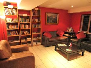 
a living room filled with furniture and a fire place at Sleepzone Hostel Galway City in Galway
