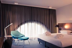 Postel nebo postele na pokoji v ubytování Mercure Hotel Nijmegen Centre